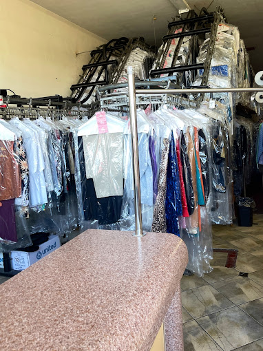 Garments hanging on conveyor